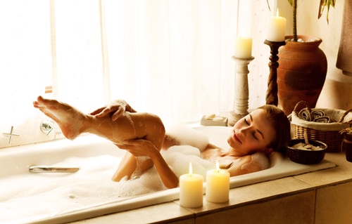 Enjoying a bath at an in room jacuzzi