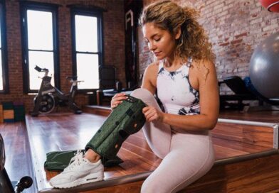 A woman starts up her Spryng before a workout