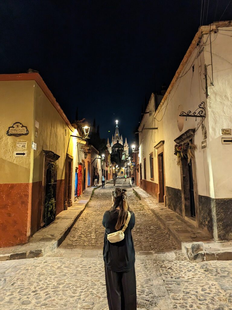 Looking down an evening alley in SMA with the Best Hoka shoes for Travel