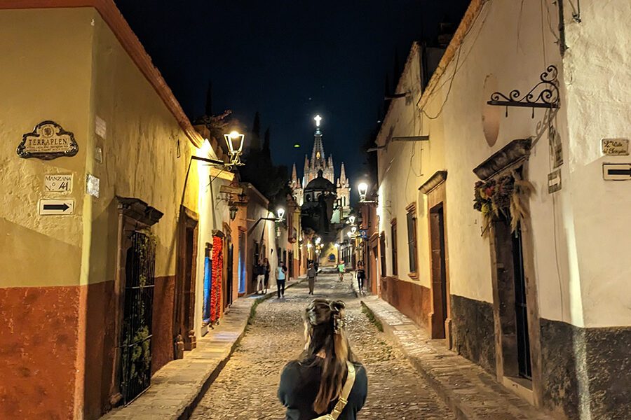 Looking down an evening alley in SMA with the Best Hoka shoes for Travel