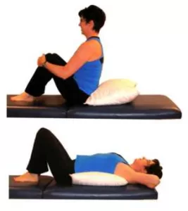 using a pillow to lengthen and decompress the spine with traveling