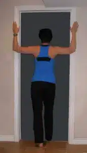 the doorway stretch is a great way to fight back pain while traveling